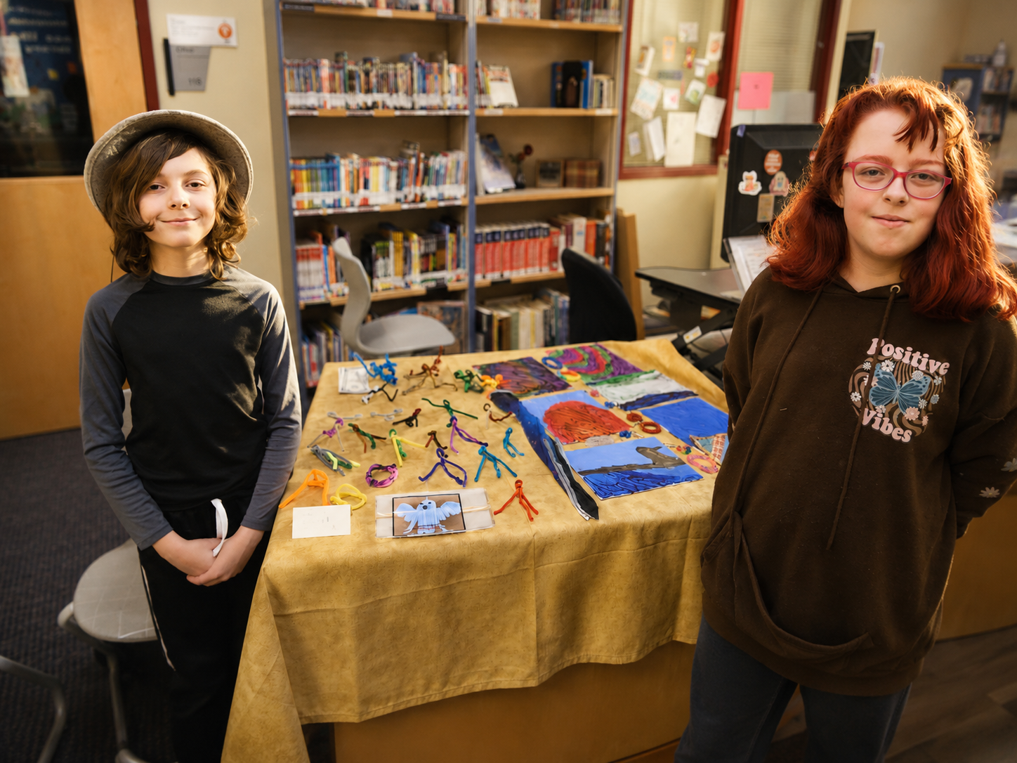 Children proudly showing their stand