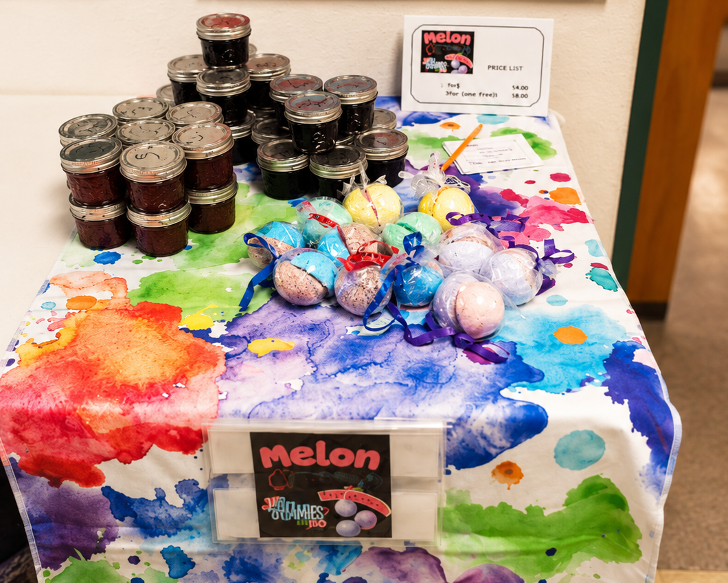 Student-made bath bomb products displayed at an AllBoss marketplace